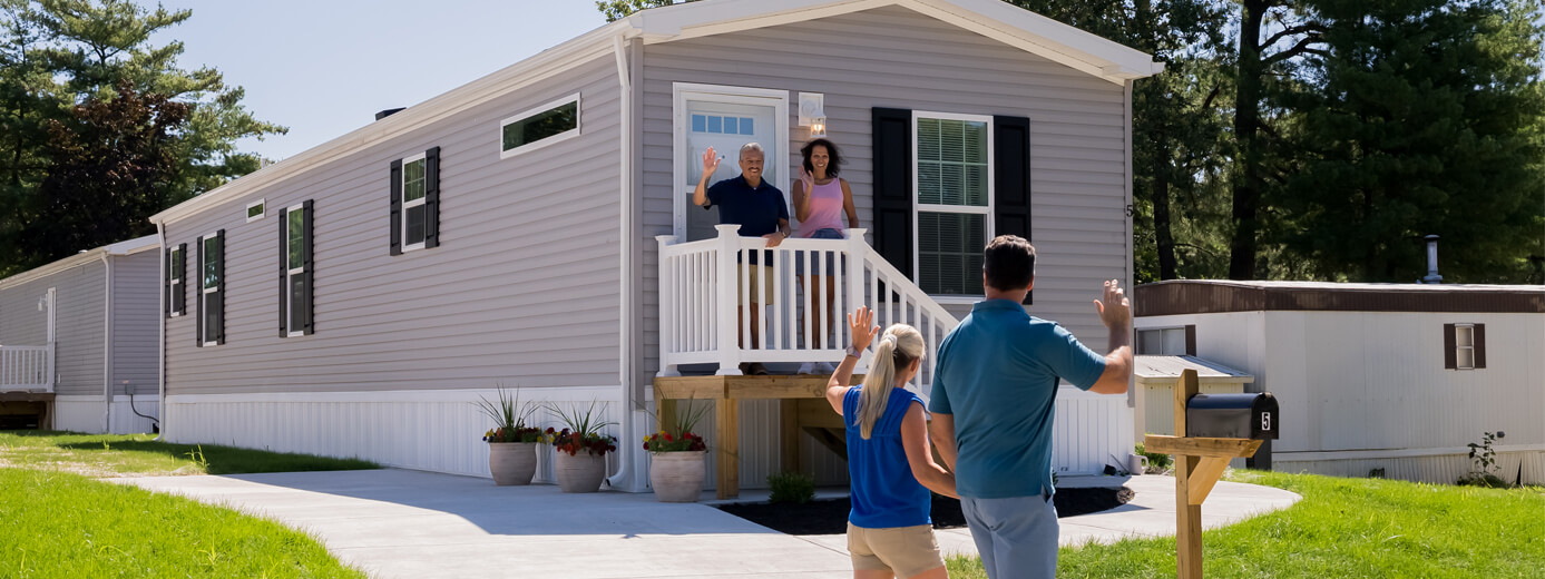 Residents standing outside their home